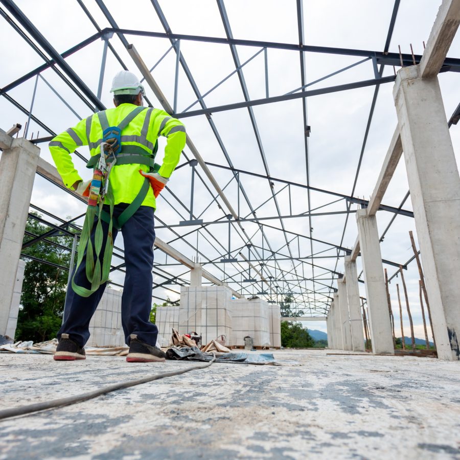 construction worker standing in building frame