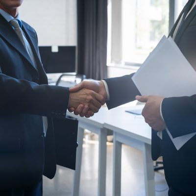 two men shaking hands